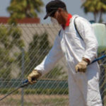 Professional exterminator spraying for bugs in the Mississippi gulf coast; Southern Pest Control
